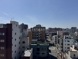 グランクレイエル両国 複数の建物が立ち並ぶ都市風景と青空が広がる眺望