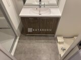 ルミーク大森 木目調の洗面化粧台と落ち着いた雰囲気の洗面室