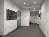 アルコバレーノ亀戸2 大理石調のタイルが落ち着いた印象のエントランスホール