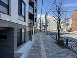 タスキスマート新大塚3 建物前の歩道から見た落ち着いた街並みの様子