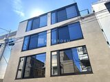 ザ・レジデンス市谷台町 大きな窓が並ぶモダンな建物の外観