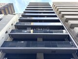 アーバネックス日本橋水天宮前 下から見上げた建物の外観、モダンなバルコニー構成が印象的
