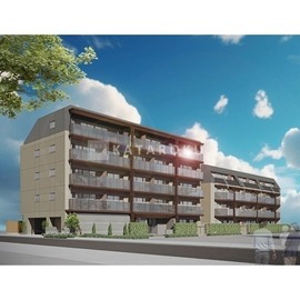 デュオフラッツ一之江イースト 青空を背景に、バルコニー付きの中高層マンションが建つ外観